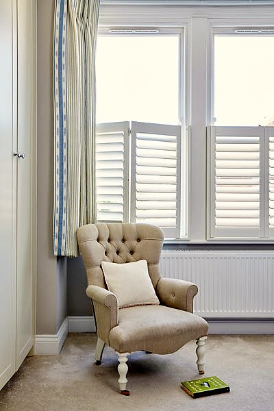 detail of a room window with cafe style shutters