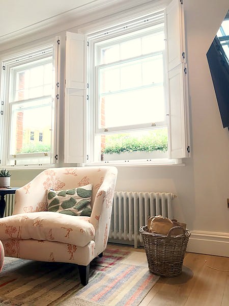 room with windows and solid shutters 