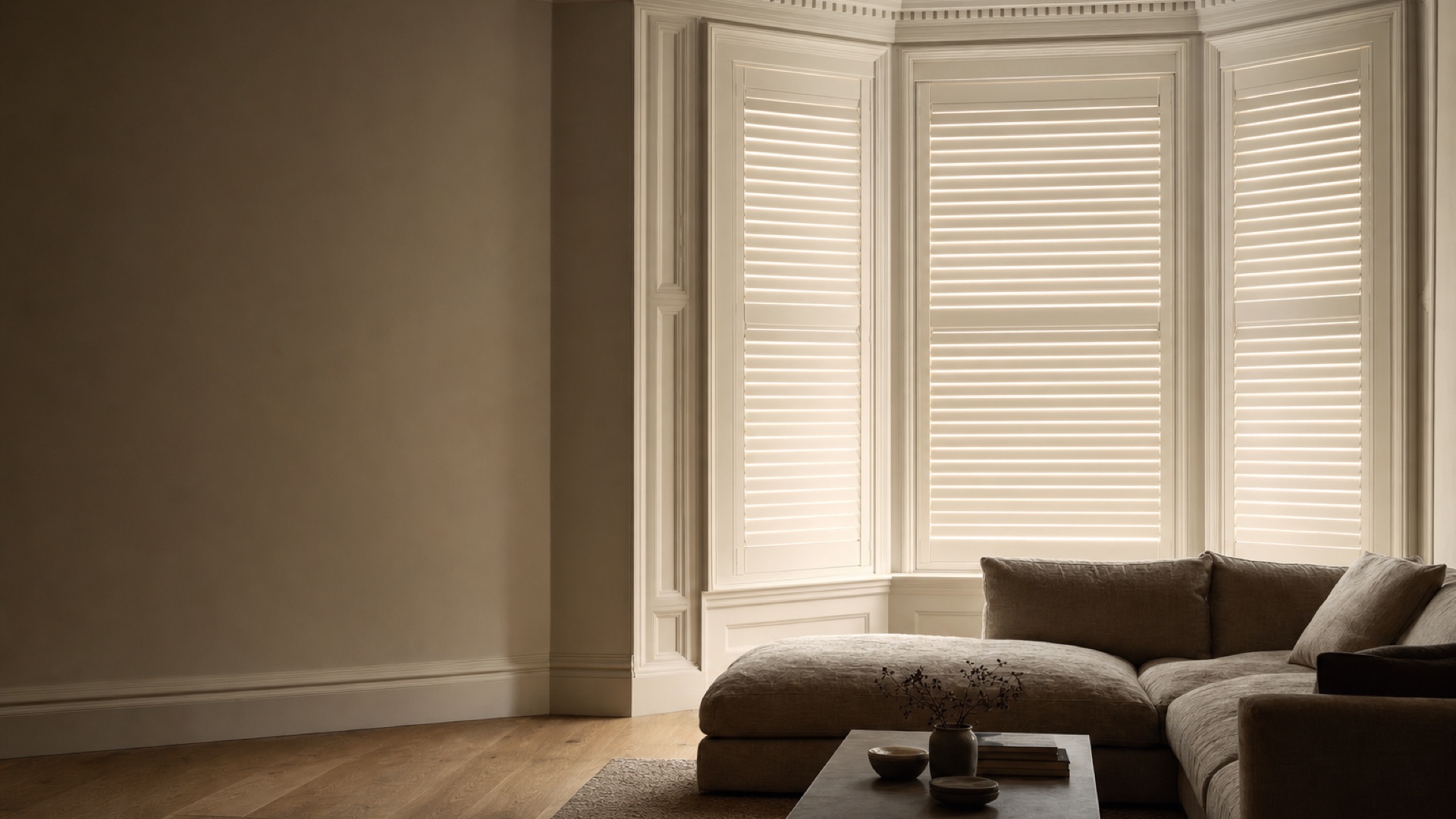Bespoke white plantation shutters in a London townhouse bay window