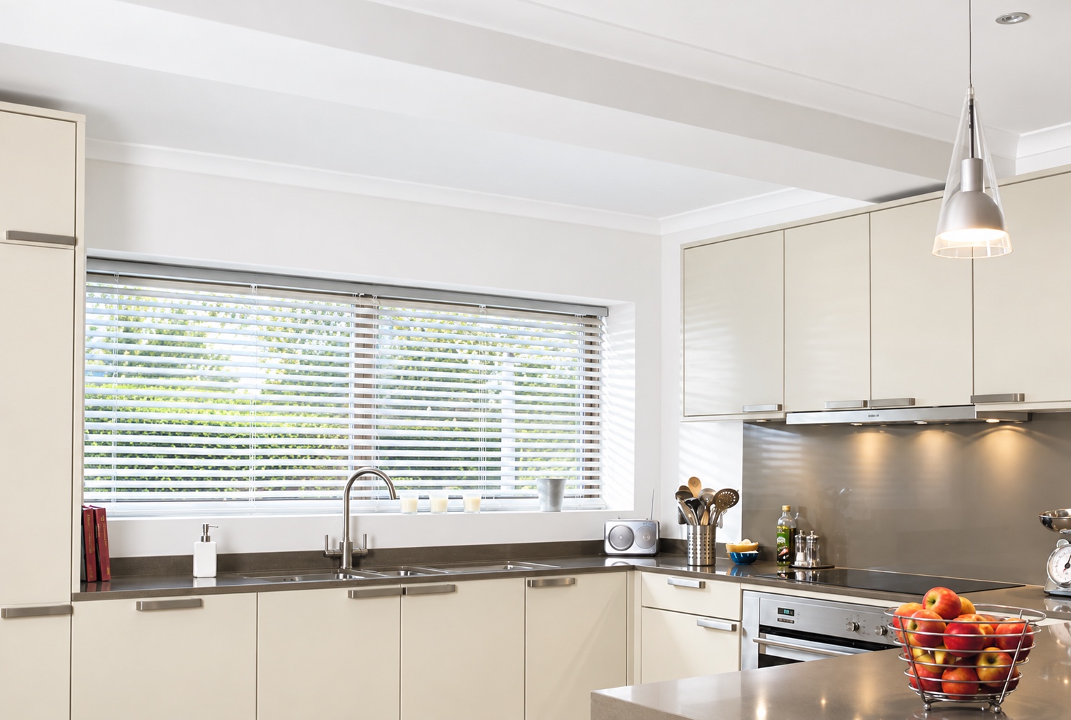 Wooden Venetian blinds fitted in a modern kitchen