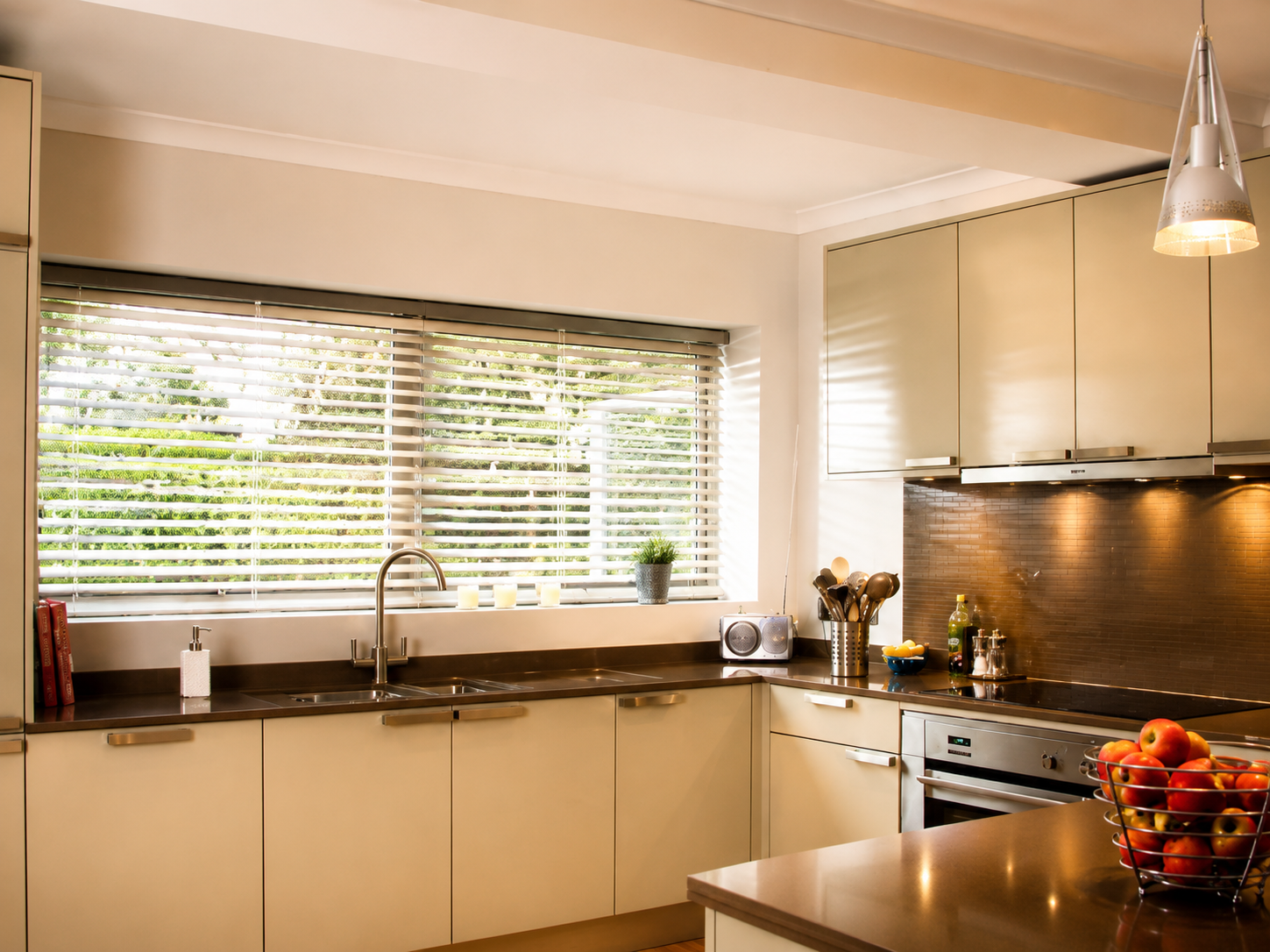 Wooden Venetian blinds fitted in a modern kitchen