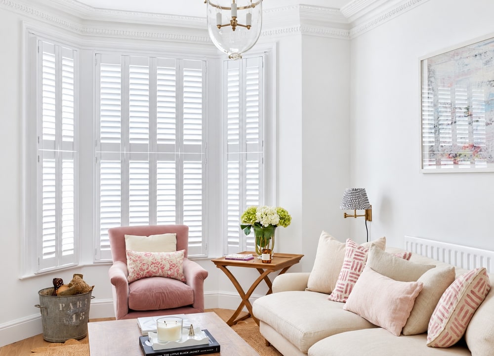 Tier-on-tier shutters fitted to a bay window