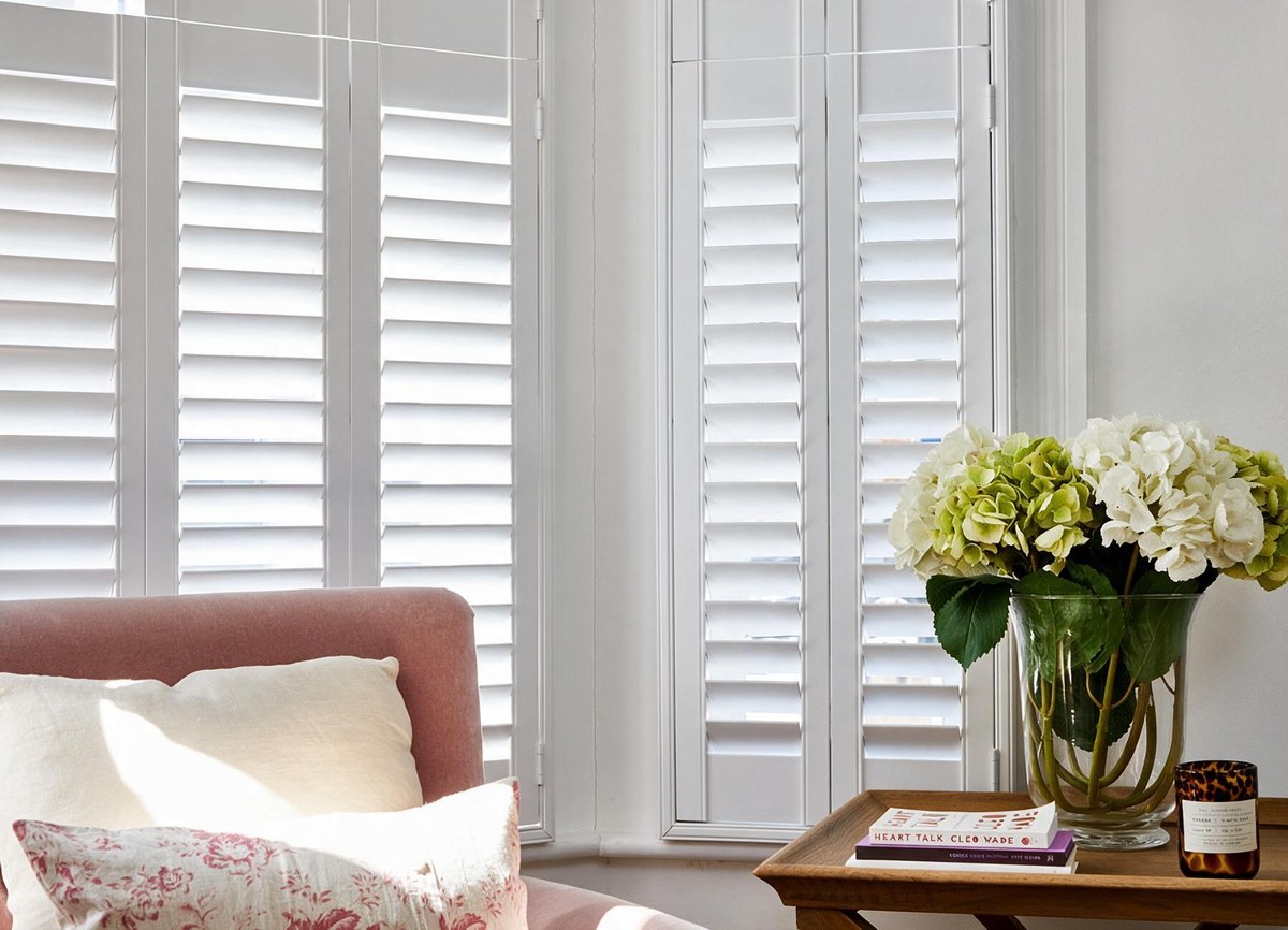 tier-on-tier shutters fitted to a window in a living room