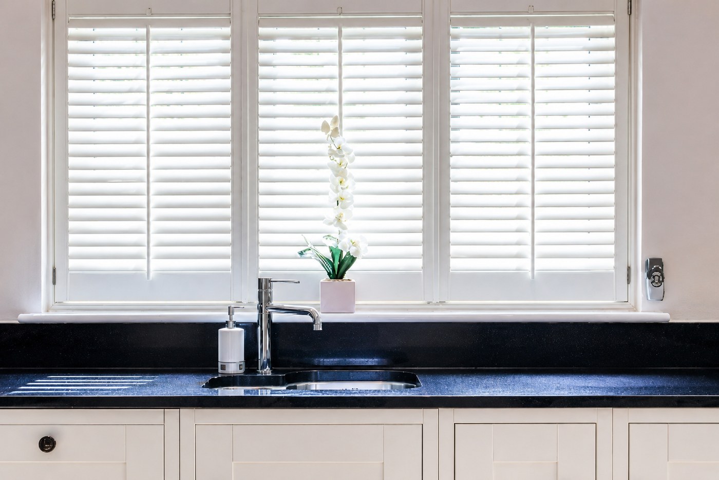 Full height shutters in a bright kitchen