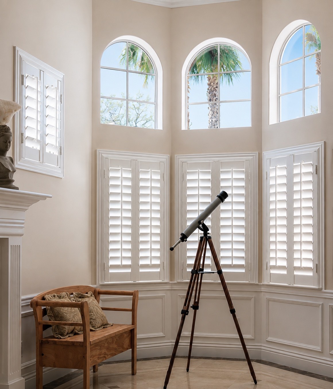 Made-to-measure shutters fitted across a detailed multi-window bay
