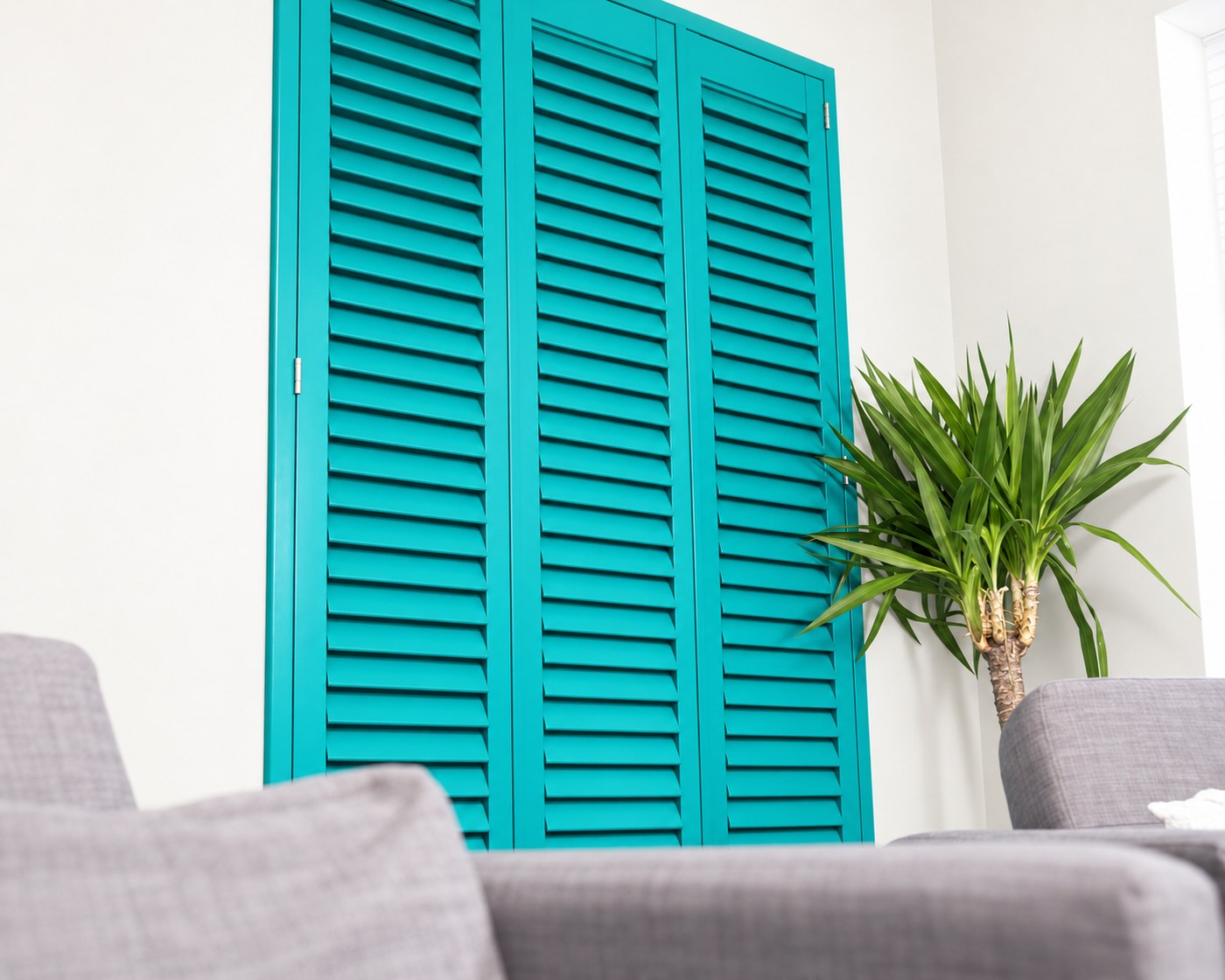 Teal Java waterproof shutters in a living space
