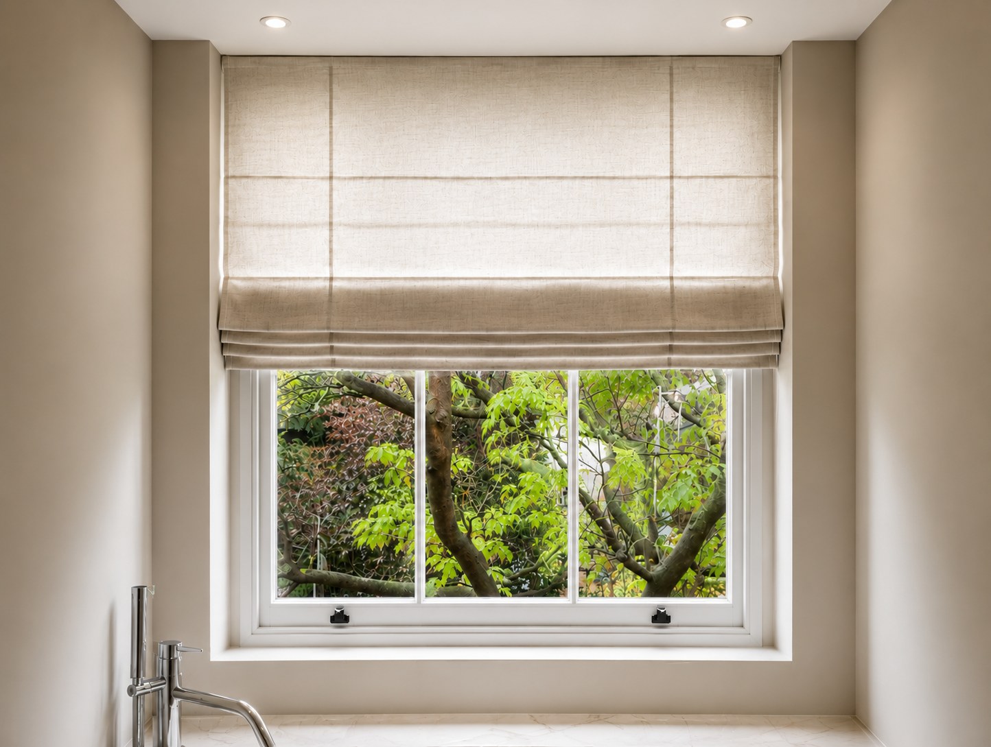 Roman blinds on a sash window in a small bathroom