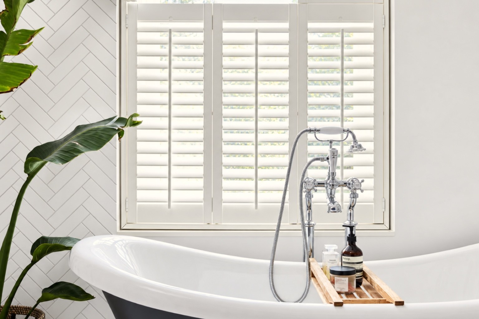 Java waterproof café style shutters beside a bath