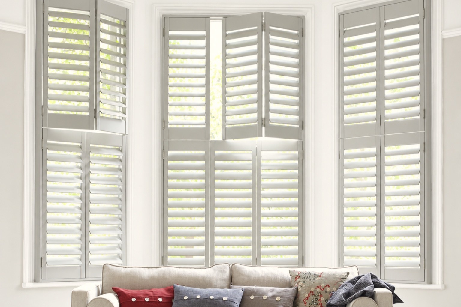 Hawaii Paulownia hardwood shutters with dark painted louvres