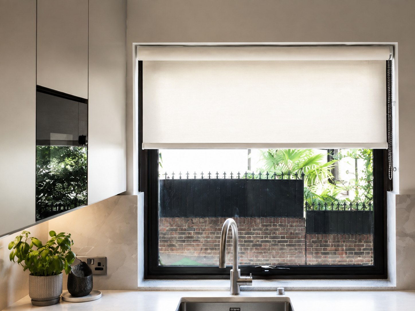 Roller blind controlling daylight at a kitchen window