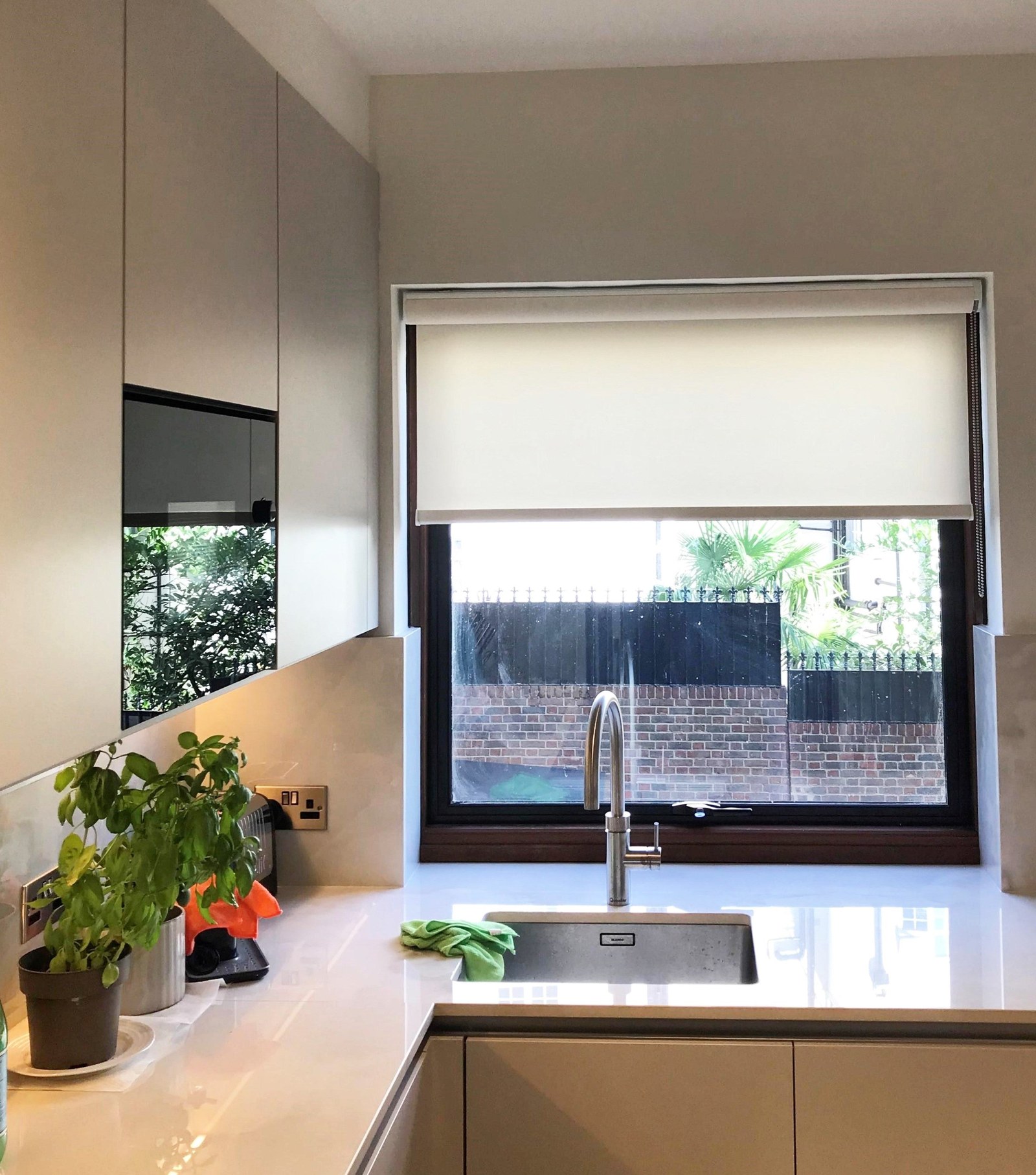 Roller blind fitted to a kitchen window