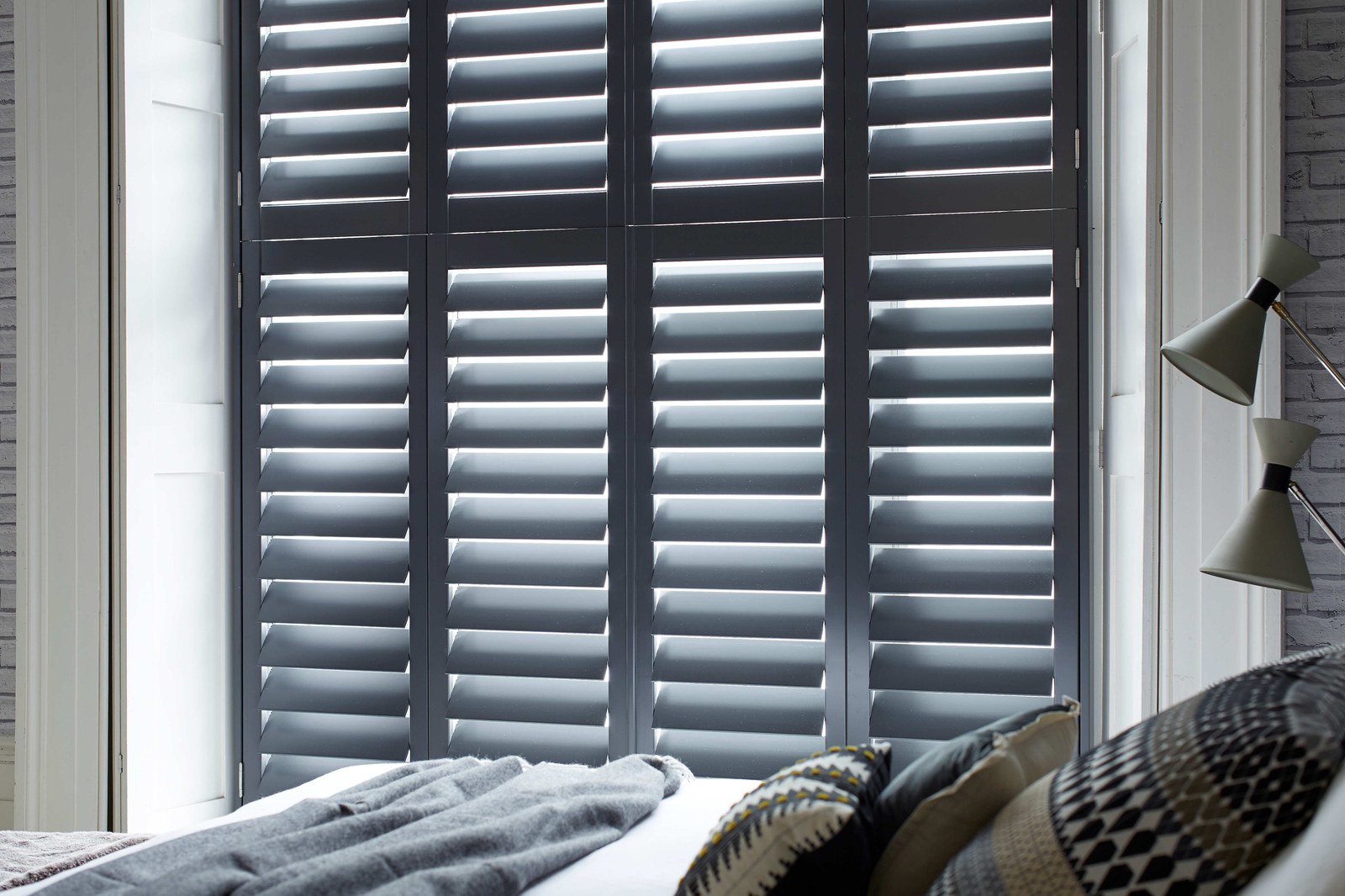 Hawaii Paulownia Full Height shutters in a bedroom