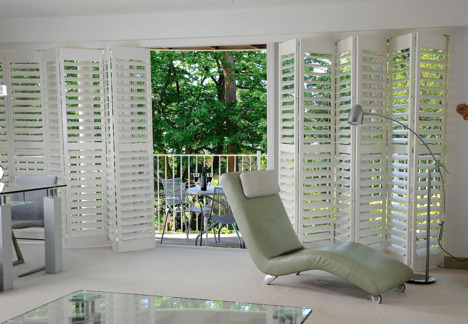 Fiji hardwood shutters opened across a wide glazed opening