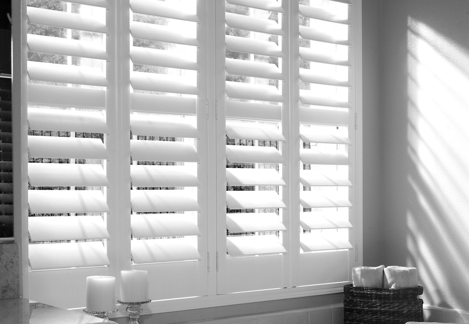 Java waterproof shutters shown across a full window opening
