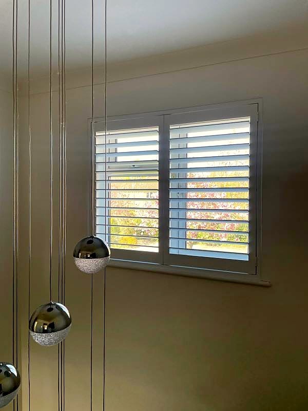 Full-height shutters installed throughout a Wimbledon home