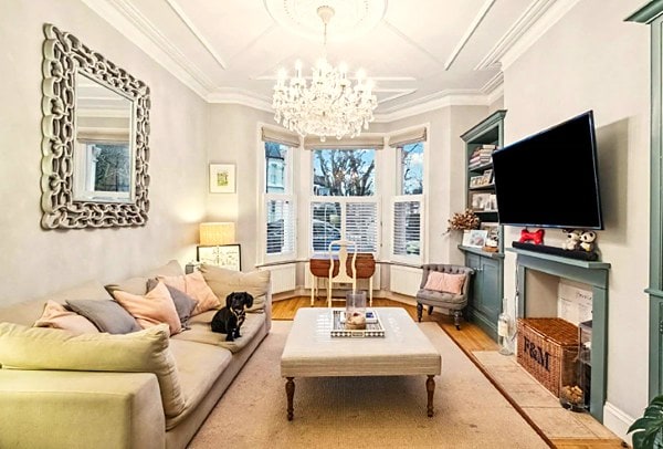 living room with bay window and half height shutters
