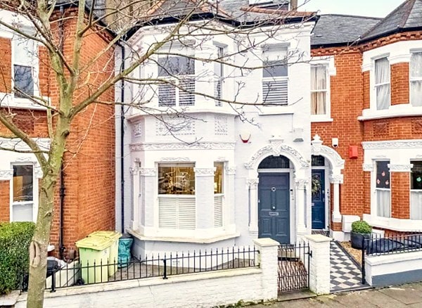 Full-height and café-style shutters in a Wandsworth property