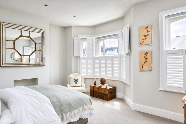 Made-to-measure shutters on a bay window