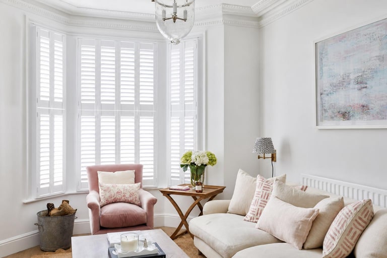 Tier on tier shutters fitted to a bay window