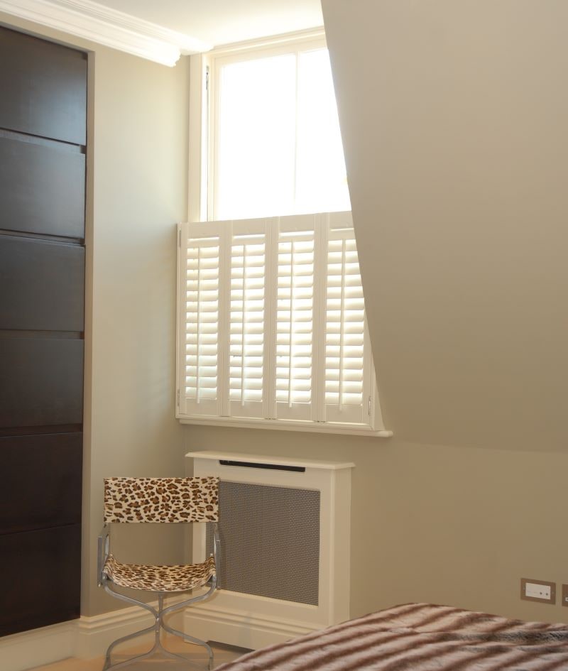 Café Style basswood shutters fitted to a bedroom window