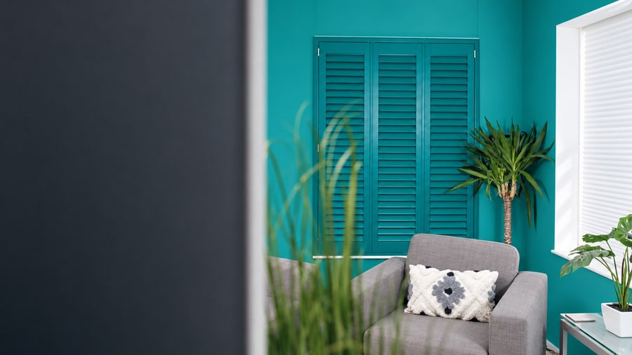 Java shutters in a teal room